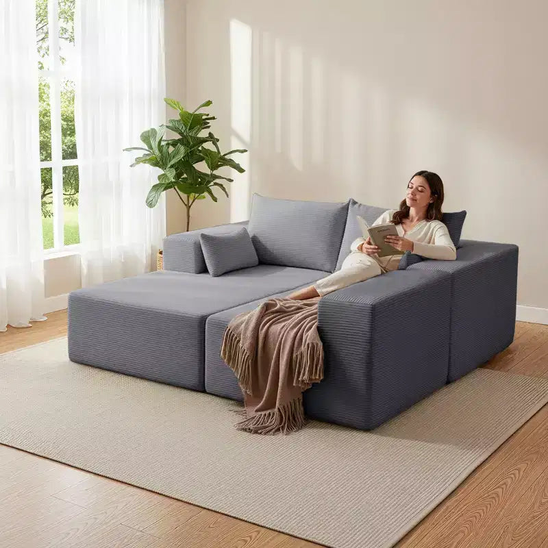Divano componibile a L in velluto a coste con pouf