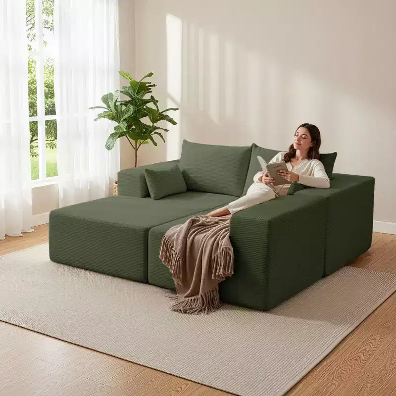 Divano componibile a L in velluto a coste con pouf