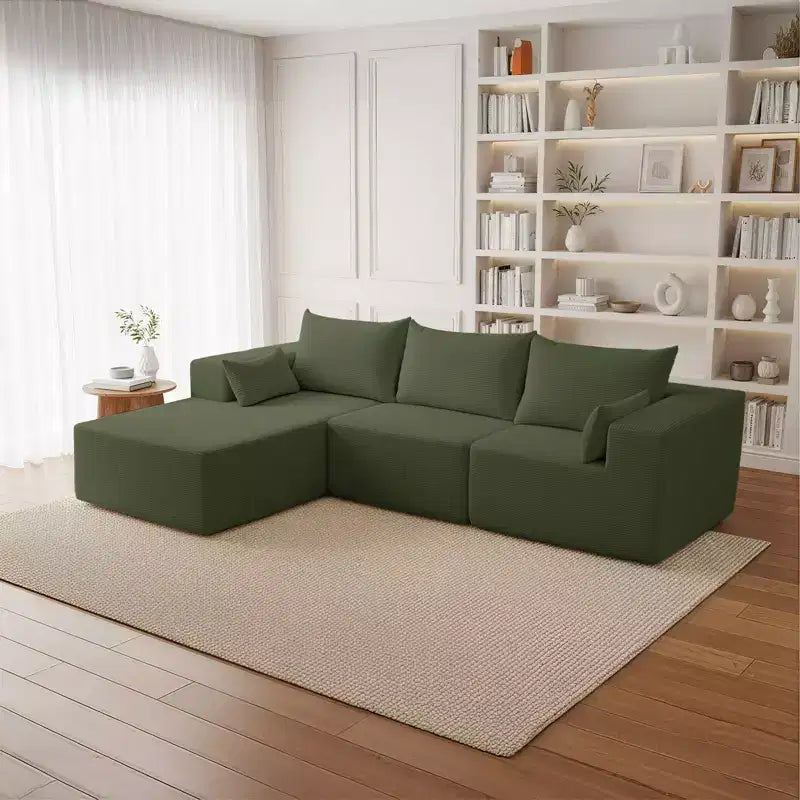 Divano componibile a L in velluto a coste con pouf